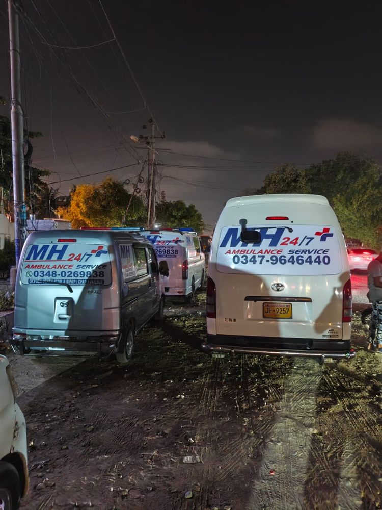 Two MH 24/7 ambulances parked together on night duty