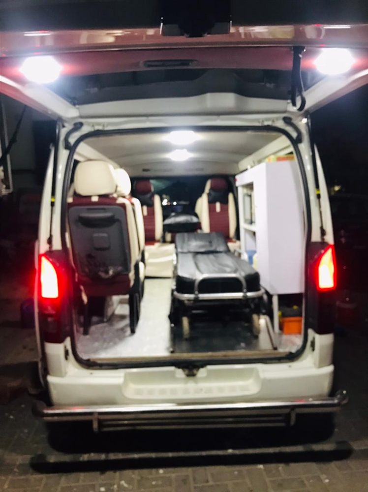 Interior of an MH 24/7 ambulance showing the stretcher and medical cabinet